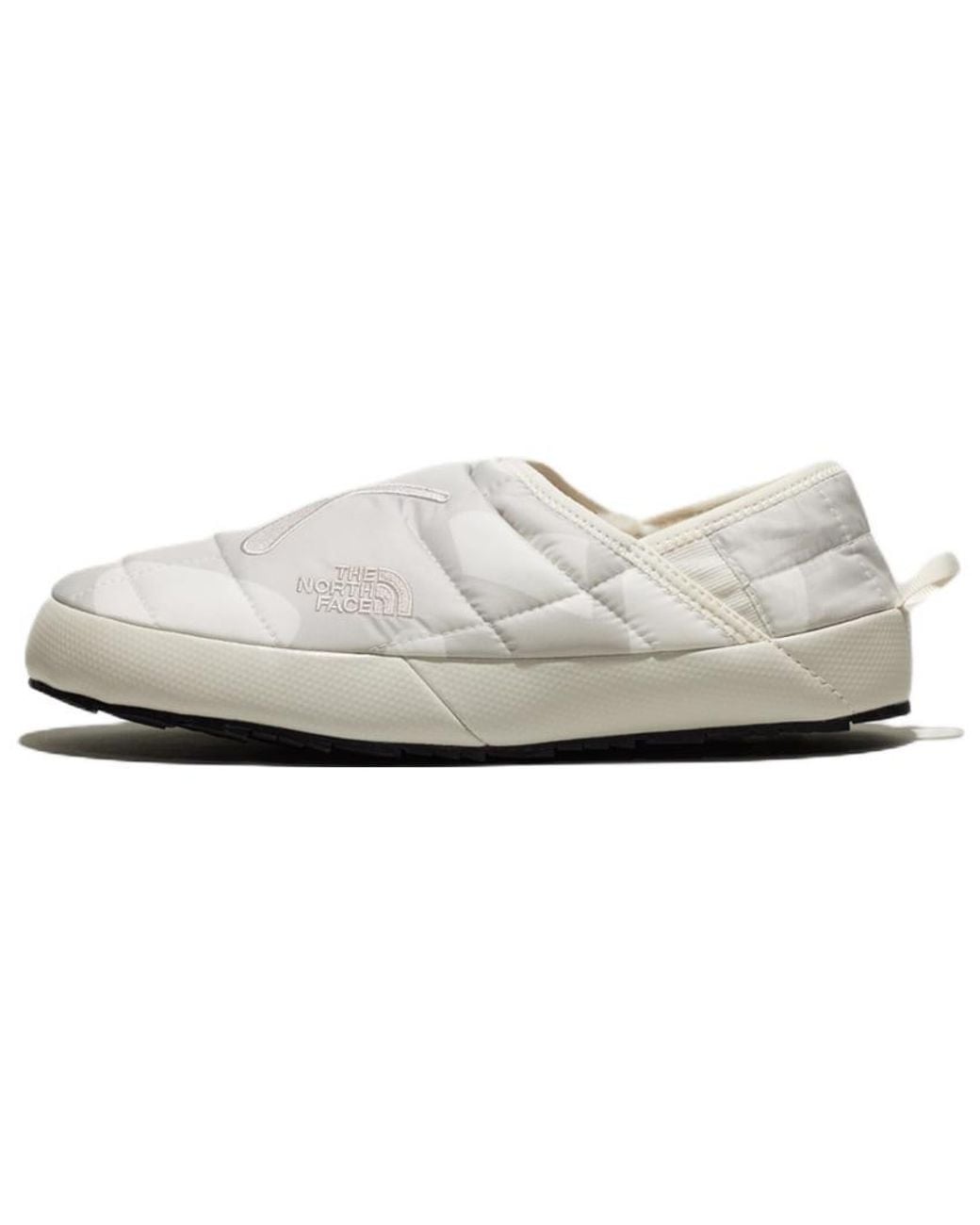 The North Face Black X Kaws Thermoball Traction 'Moonlight Ivory' for men