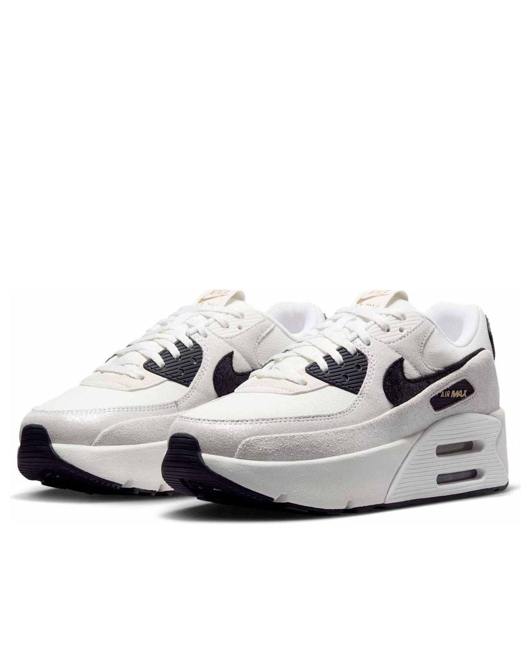 white nikes with black soles