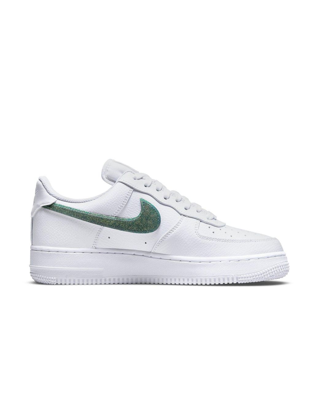 white nikes with green swoosh