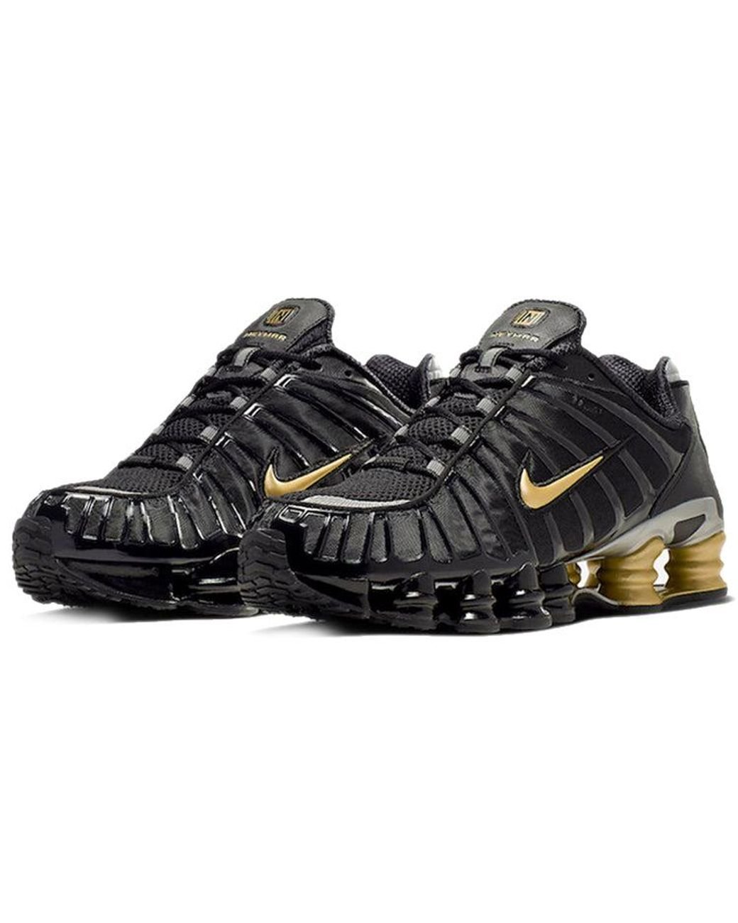 nike shox tl black and gold