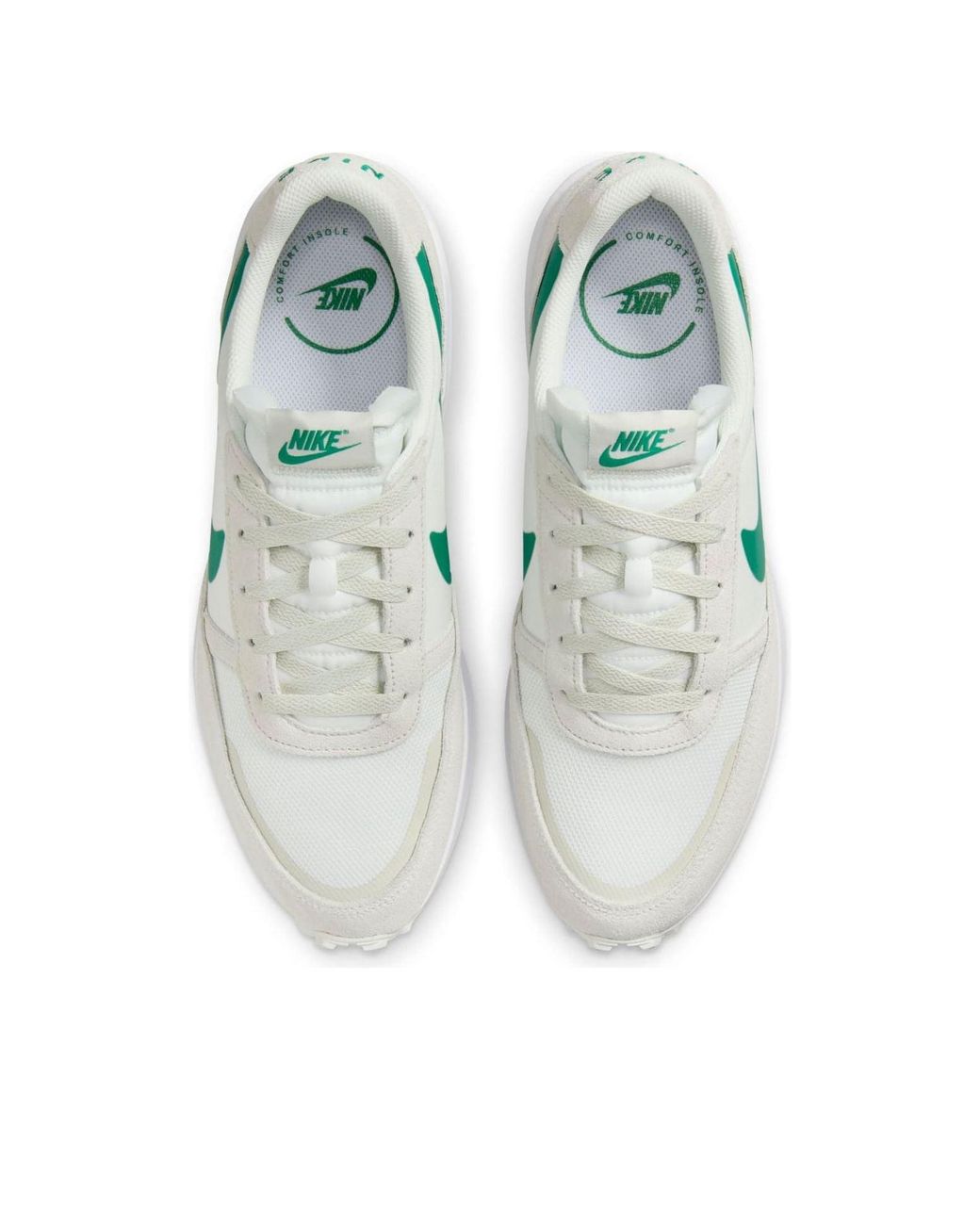 nike outburst trainers in white and green