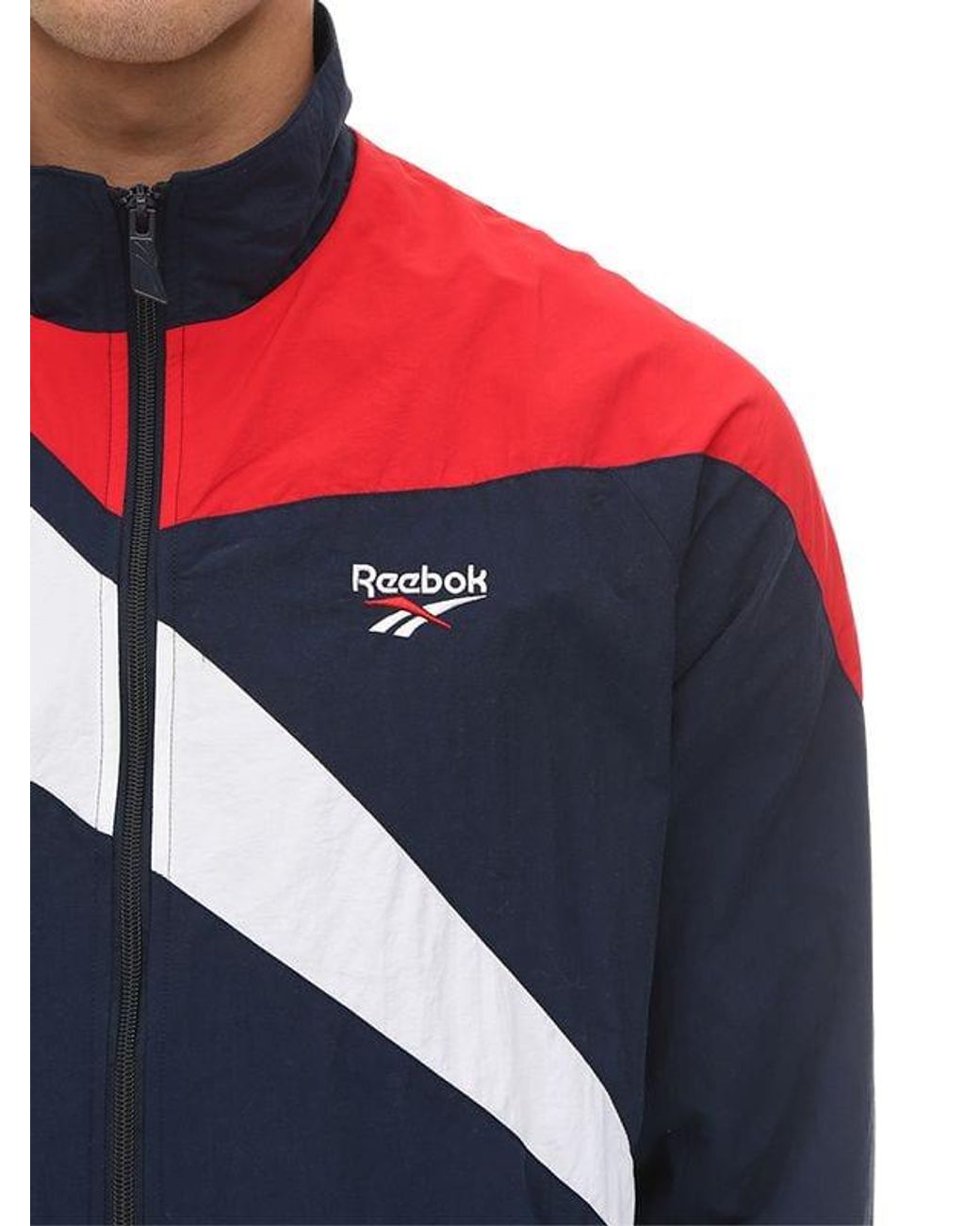 reebok lf vector navy and red track top