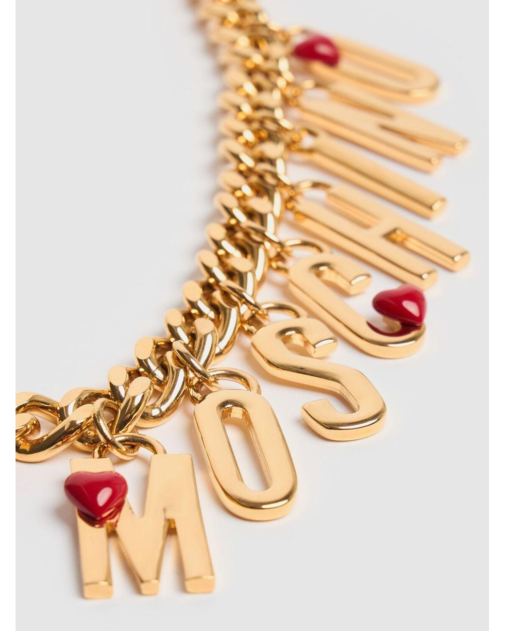 【送料&関税込】Moschino Logo Lettering Charm Detailed Neckl Moschino Logo Lettering Charm Collar Necklace in Metallic