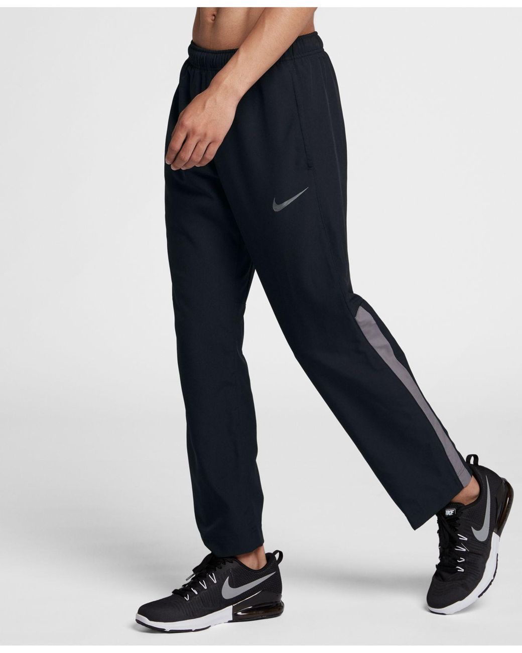 nike running challenger dri fit woven joggers in black