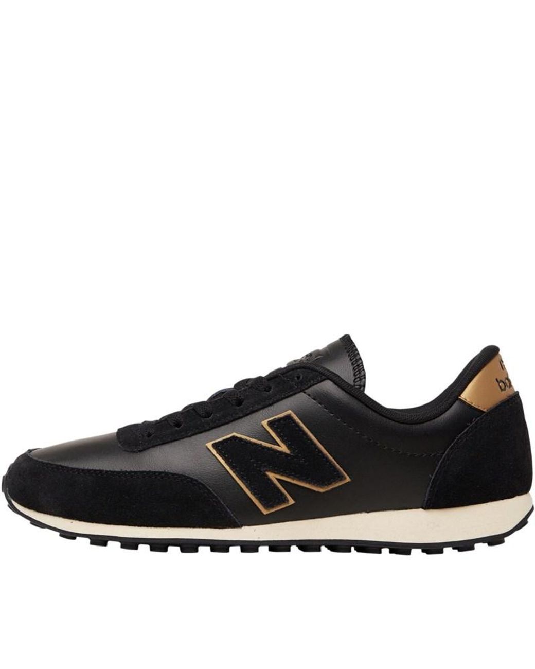 new balance 373 sneakers in black and rose gold