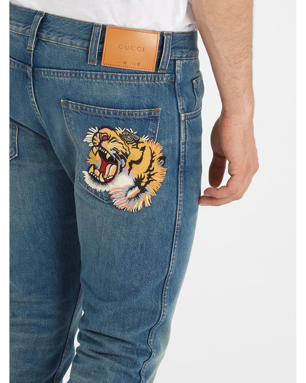 Gucci Tiger-embroidered Mid-rise Tapered-leg Jeans in Blue for Men | Lyst UK