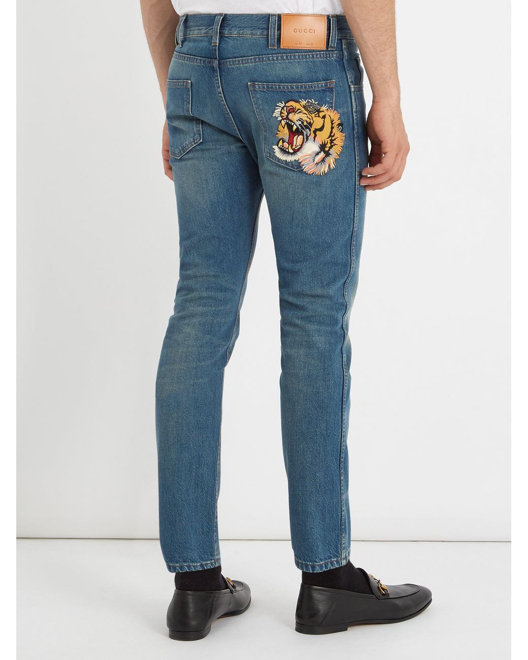 Problem vagabond køn Gucci Tiger-embroidered Mid-rise Tapered-leg Jeans in Blue for Men | Lyst UK