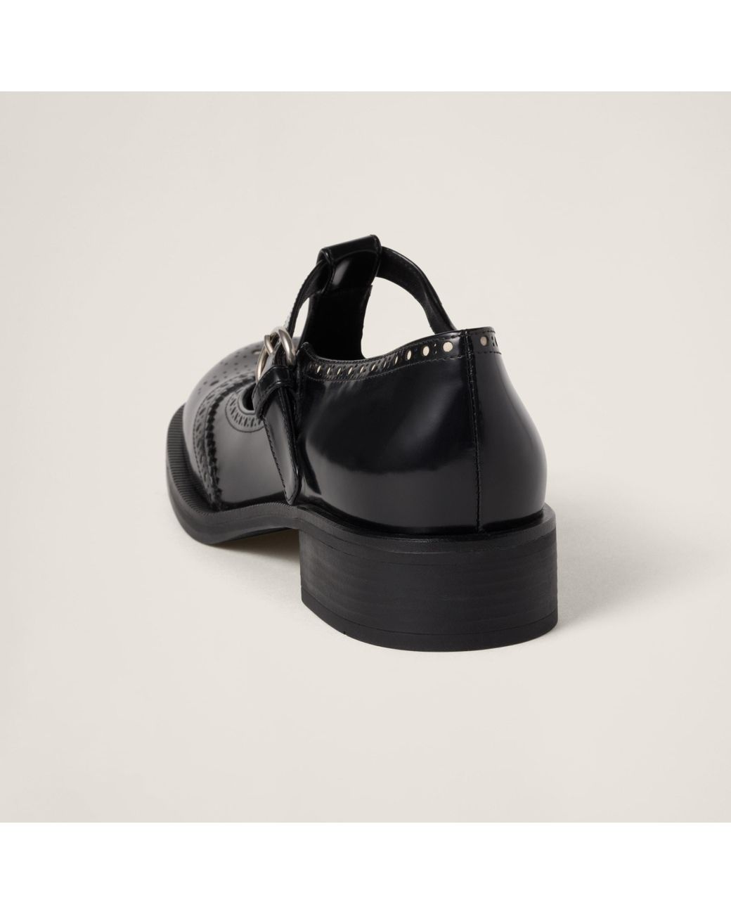 MIU MIU ◆ Brushed Leather Brogue Slingback Miu Miu Brushed Leather Brogue Slingback T-Strap Pumps in