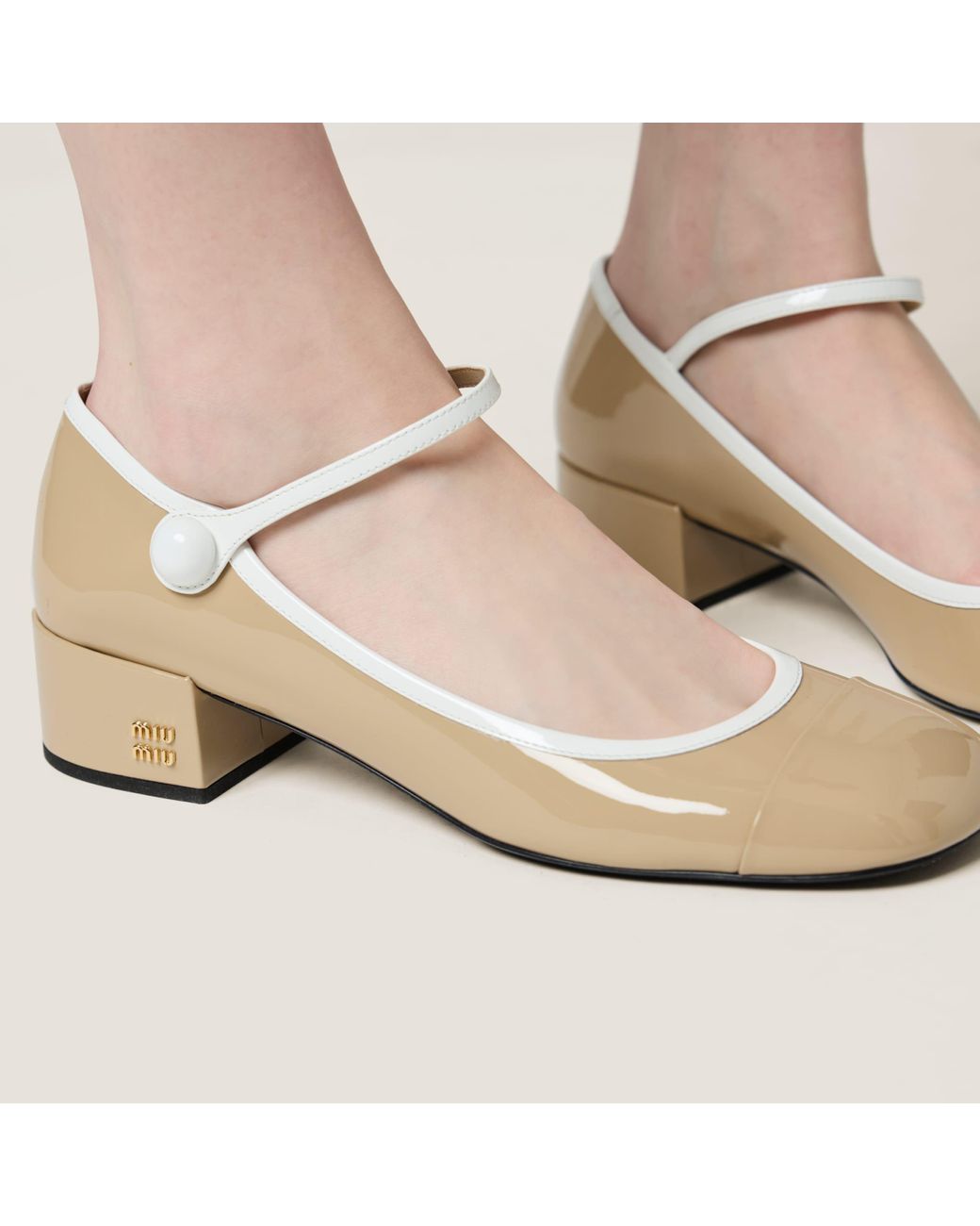 Miu Miu Two-Tone Patent Leather Mary Jane Pumps in Natural