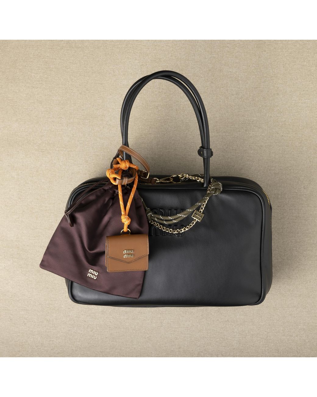 【MiuMiu】Leather, cord, and l trick Miu Miu Leather, Cord, And Metal Trick in Natural | Lyst