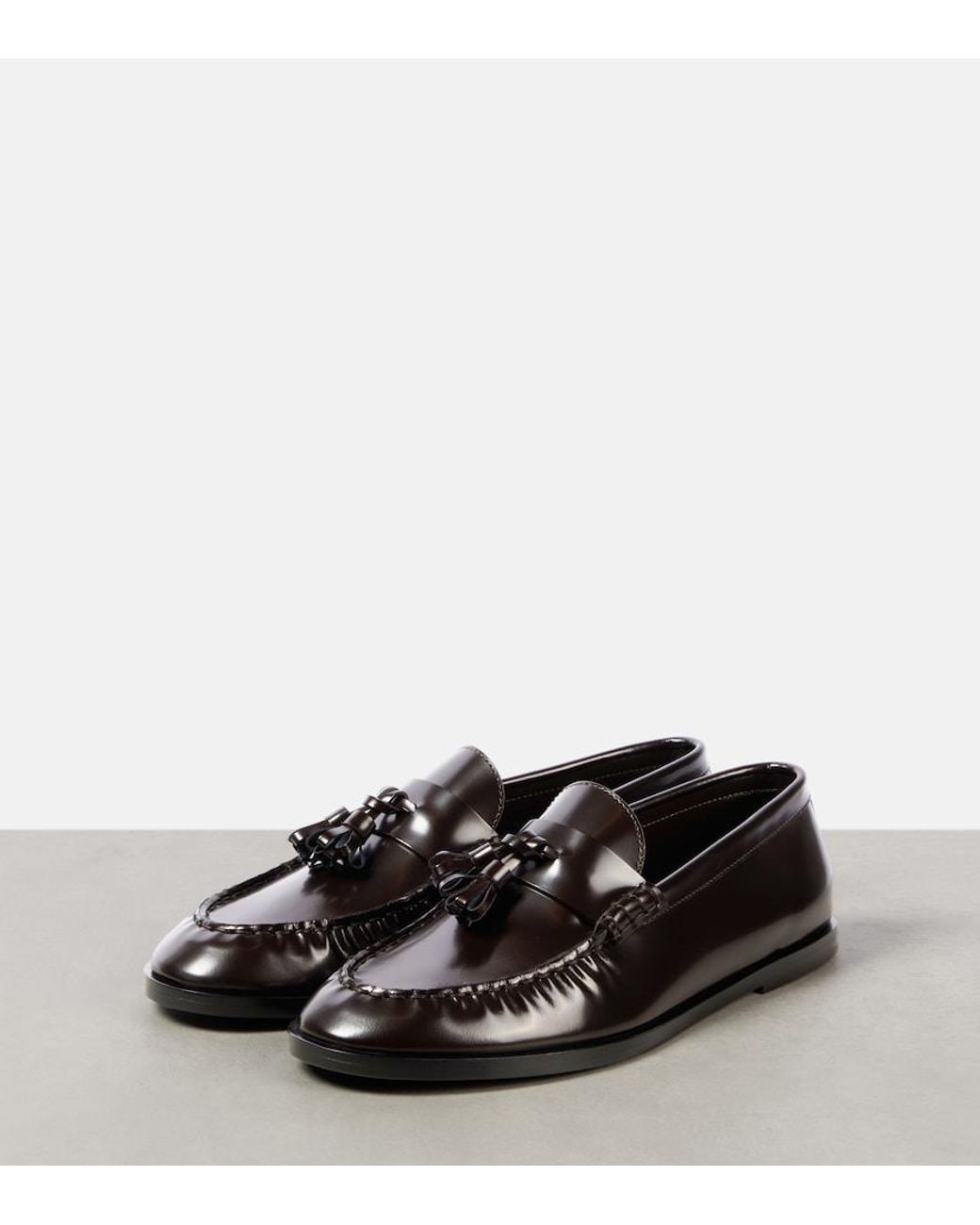 The Row Black Leather Penny Loafers