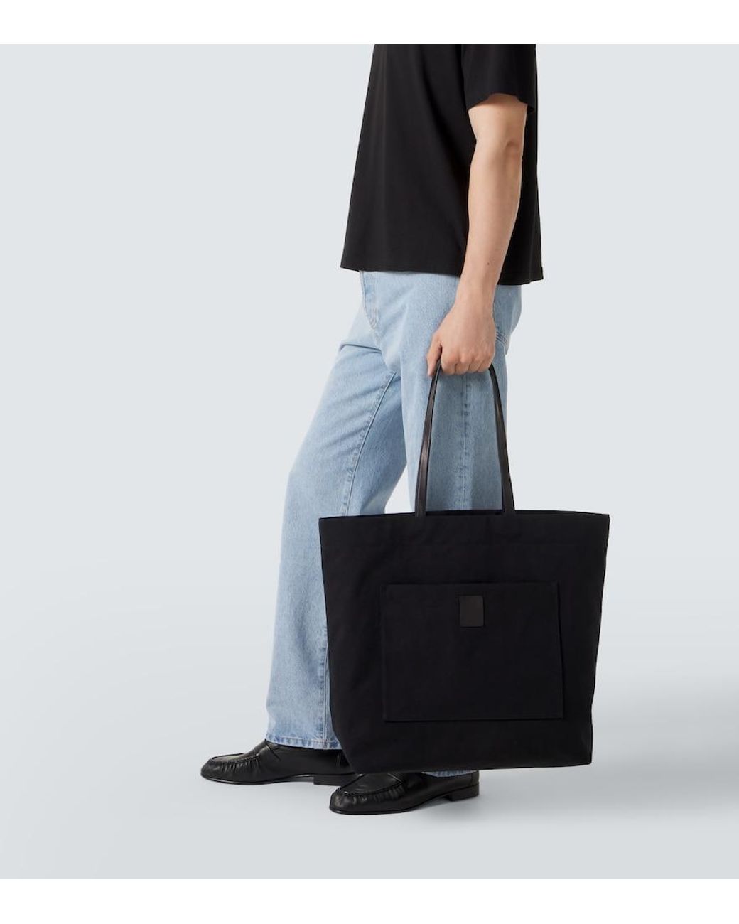 The Row Black Tori Leather-Trimmed Canvas Tote Bag for men