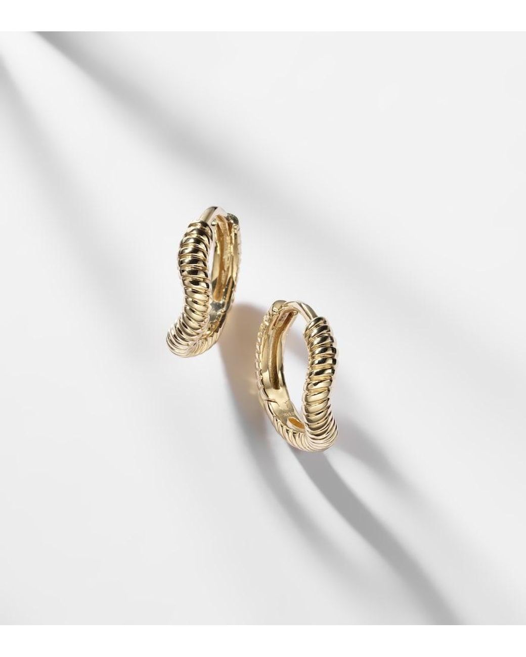 STONE AND STRAND Metallic Freddie 14Kt Huggie Earrings