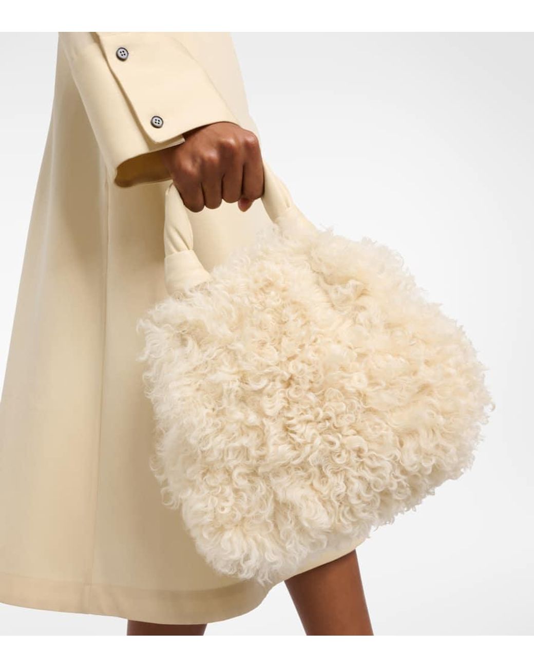 【送料 関税込】JIL SANDER Goji Small shearling tote bag Goji Small shearling tote bag in yellow - Jil Sander | Mytheresa