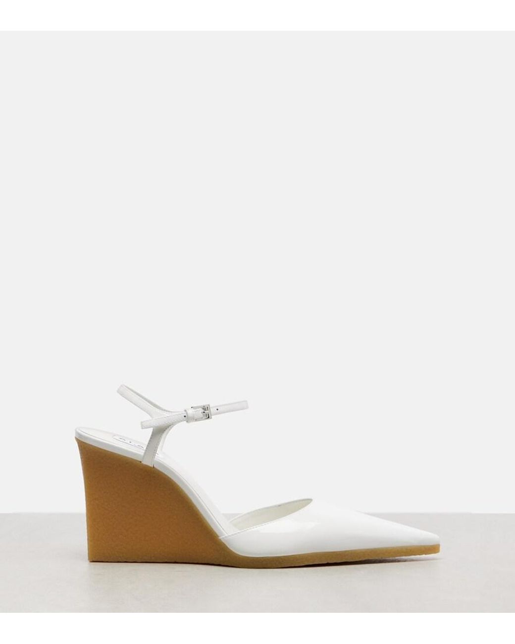 Alaïa White 90 Patent Leather Wedge Slingback Pumps