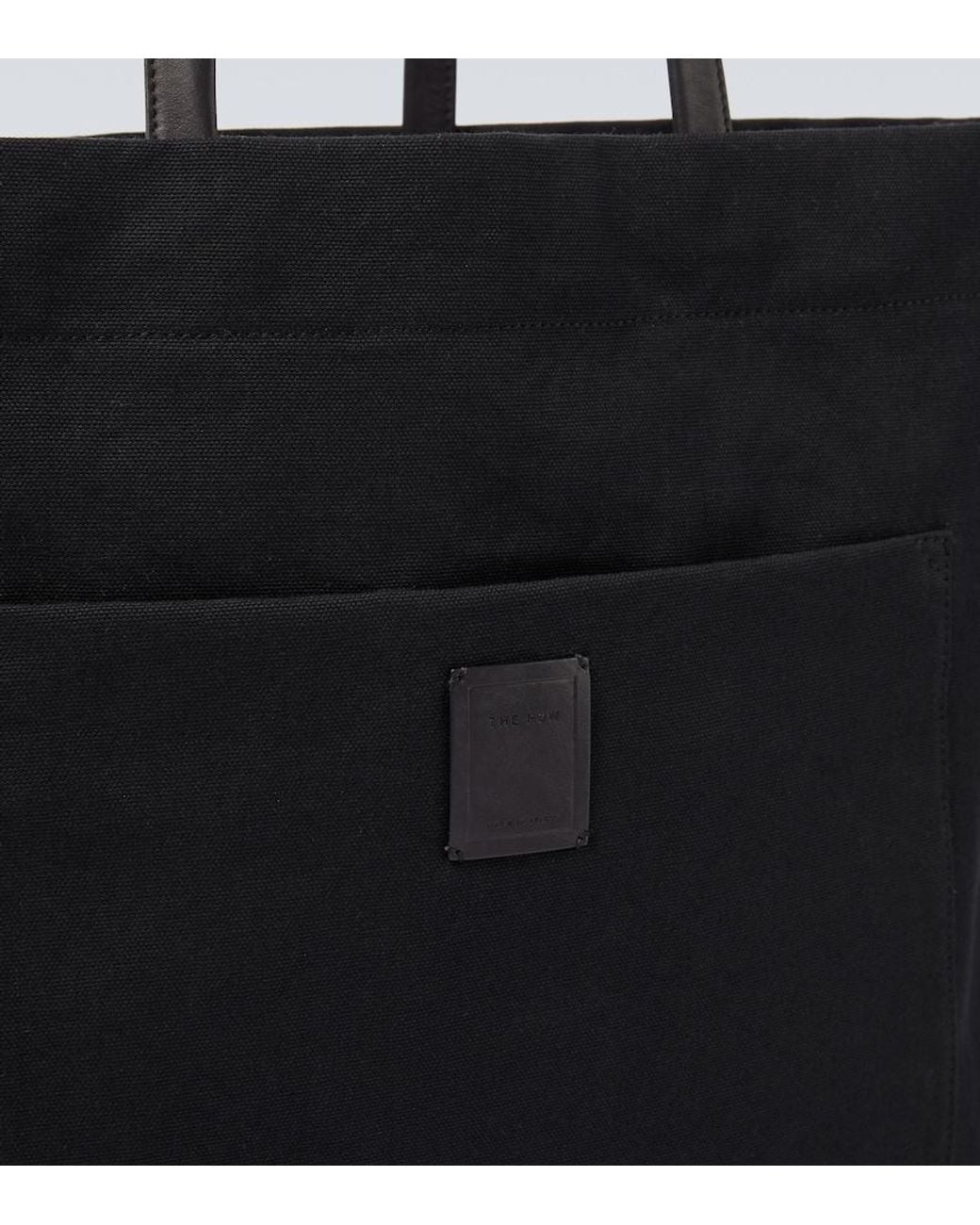 The Row Black Tori Leather-Trimmed Canvas Tote Bag for men