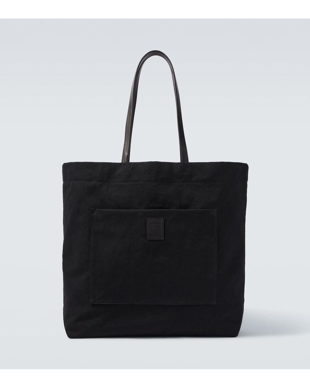 The Row Black Tori Leather-Trimmed Canvas Tote Bag for men
