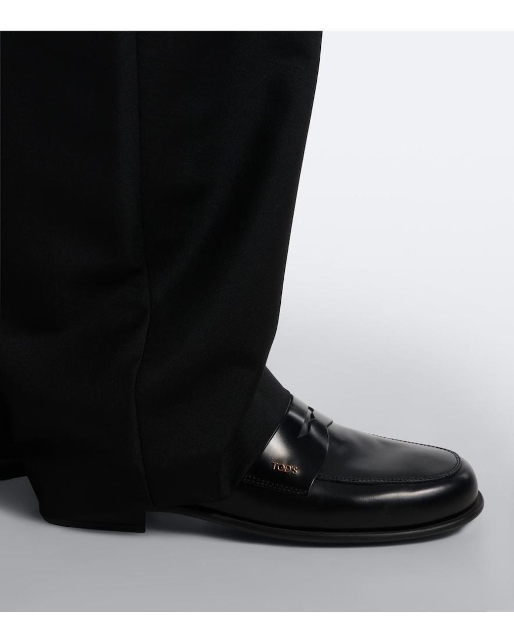Tod's Black Leather Penny Loafers