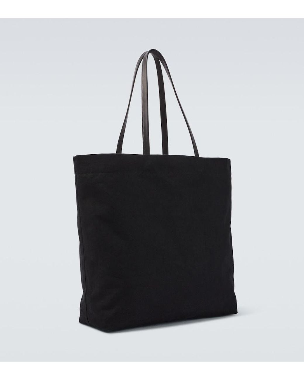 The Row Black Tori Leather-Trimmed Canvas Tote Bag for men