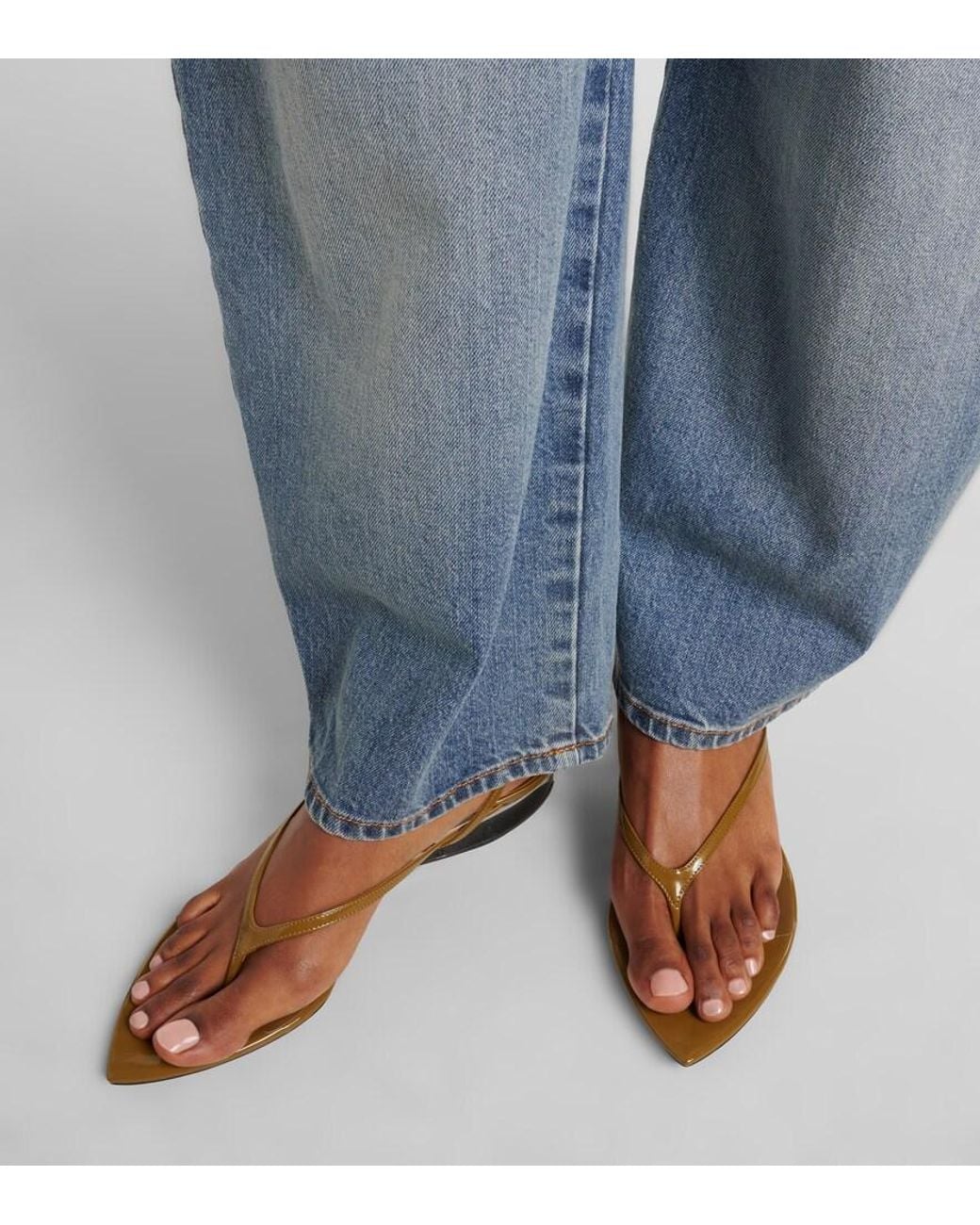 Alaïa Metallic Invisible Patent Leather Wedge Thong Sandals