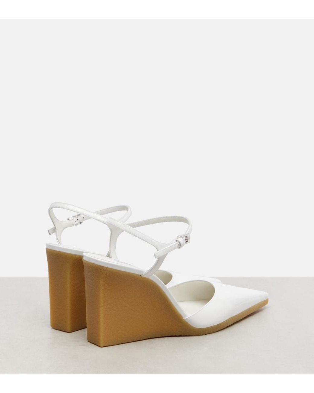 Alaïa White 90 Patent Leather Wedge Slingback Pumps