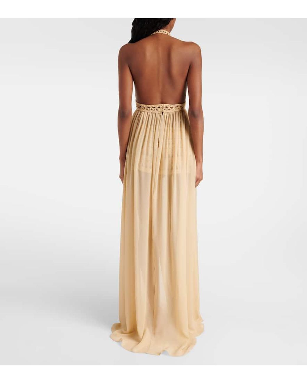 elie saab crochet dress Dusty Brown crochet echoes artisanal flair and effortless ease, with trumpet sleeves and sheer cut-out details moving like wind across dry terrain. Shop the Ready-to-Wear Spring Summer 2025 collection in all boutiques. #