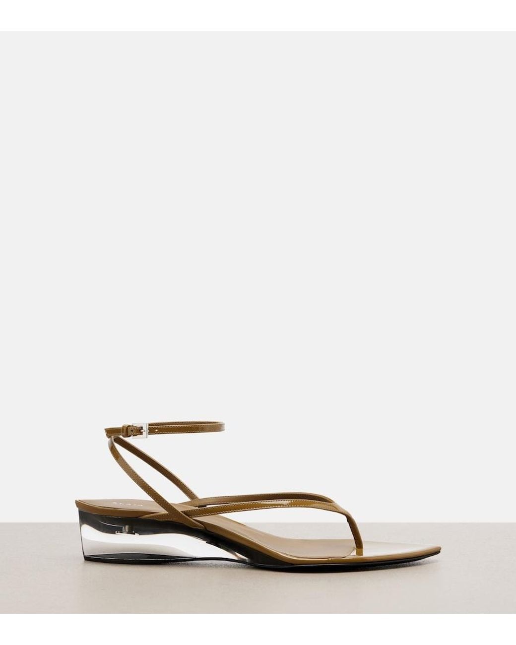 Alaïa Metallic Invisible Patent Leather Wedge Thong Sandals