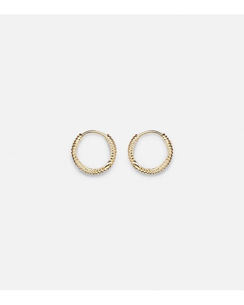 STONE AND STRAND Metallic Freddie 14Kt Huggie Earrings