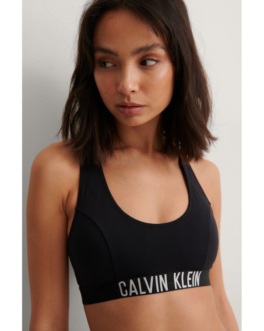 Calvin Klein Synthetic Black Bralette Swim Top - Save 39% | Lyst