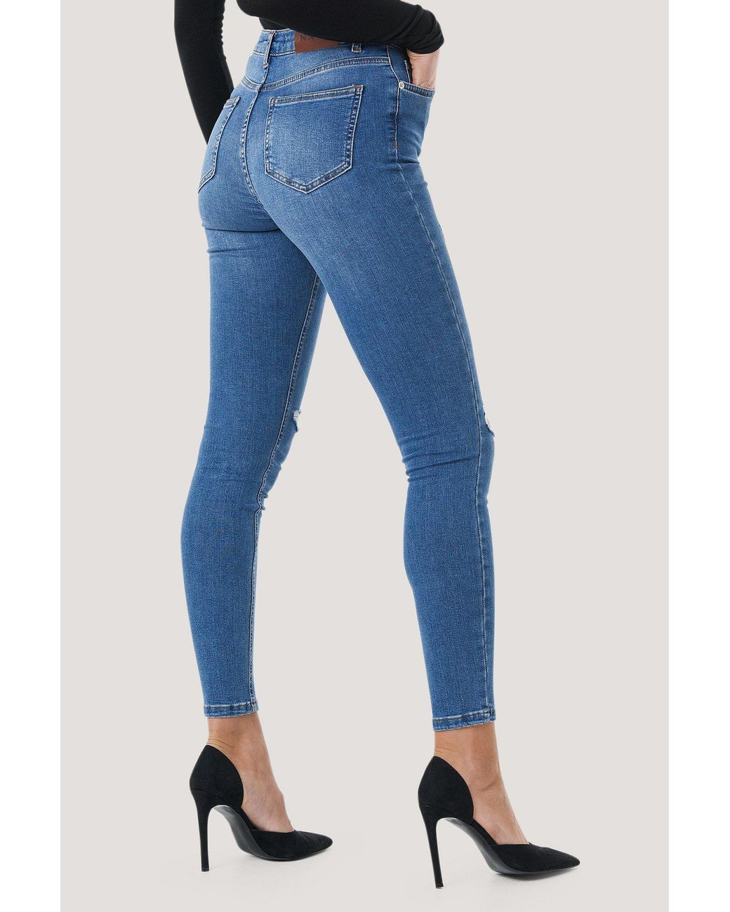 skinny mid waist destroyed jeans
