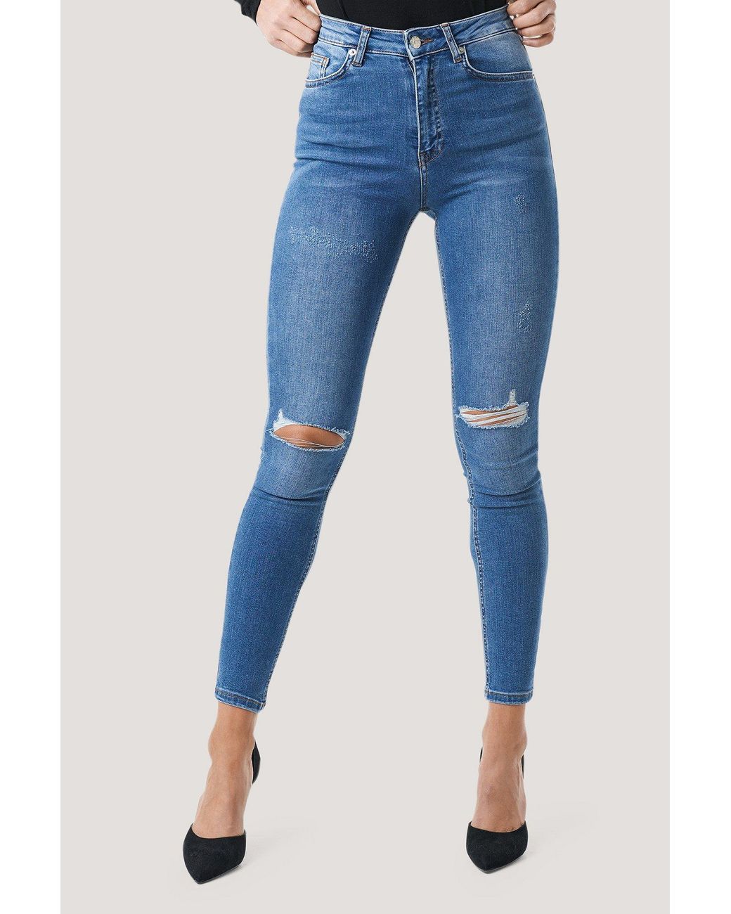 skinny mid waist destroyed jeans