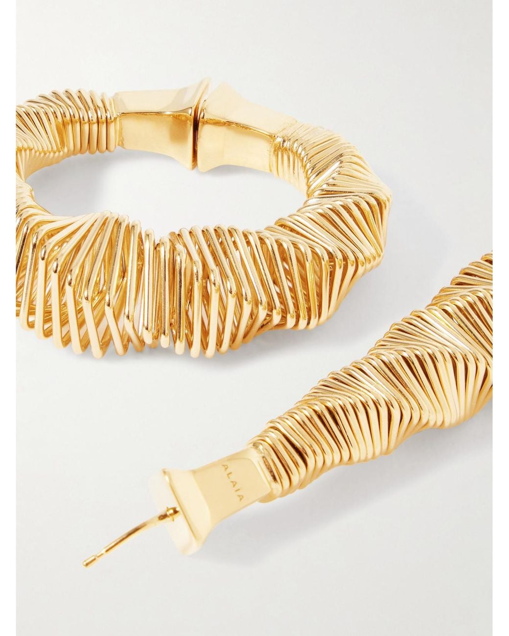 Alaïa Metallic Tone Hoop Earrings