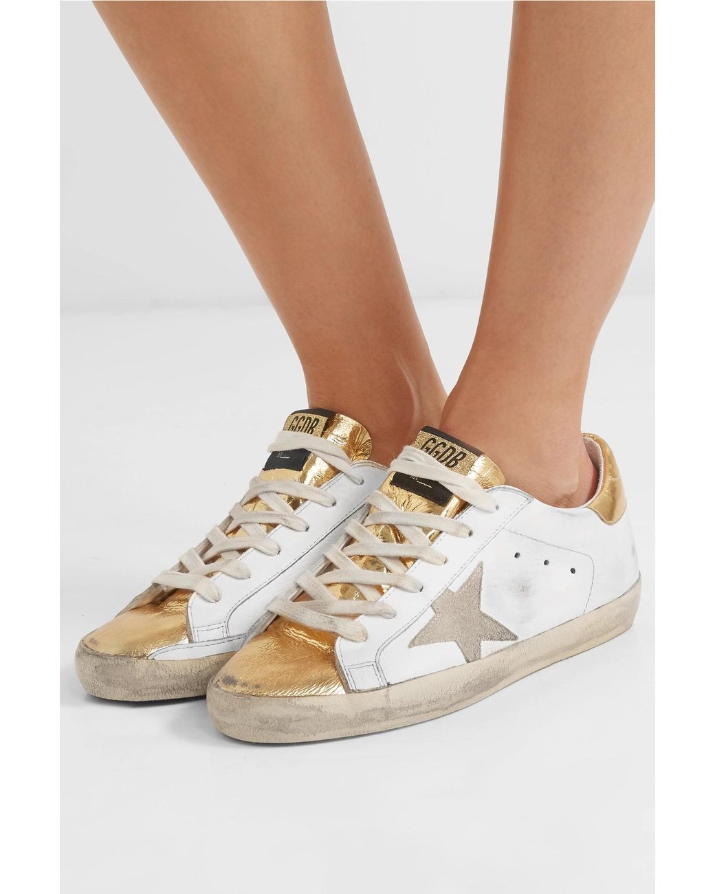 golden goose deluxe brand women's white superstar distressed metallic  leather trainers