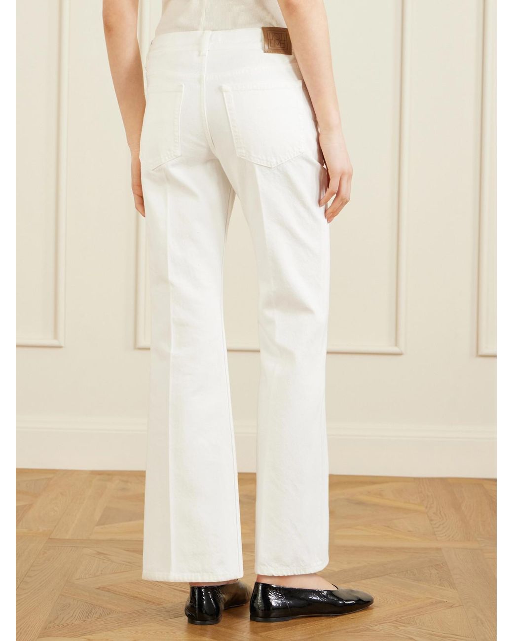 Totême White Kick Organic Flared Jeans