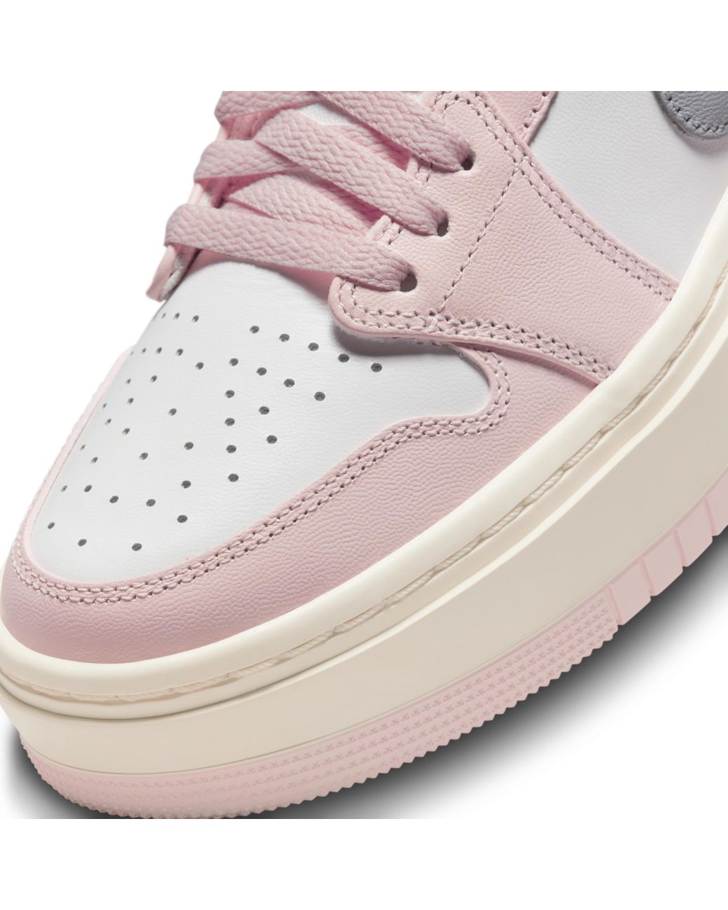 Pink and white low top outlet jordans