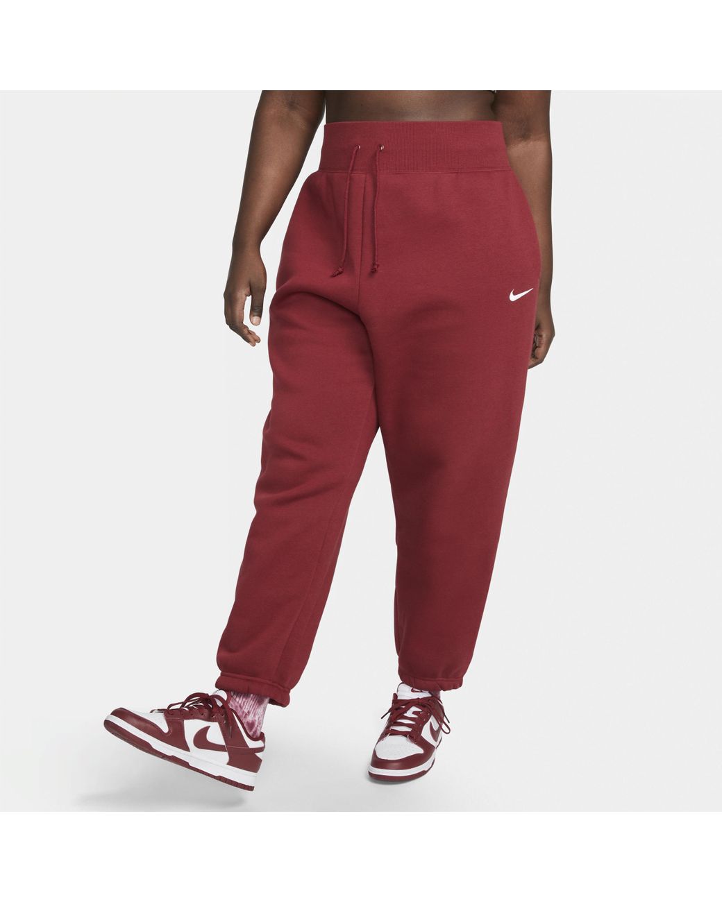 Pantaloni tuta oversize a vita alta sportswear phoenix fleece di Nike in  Rosso | Lyst