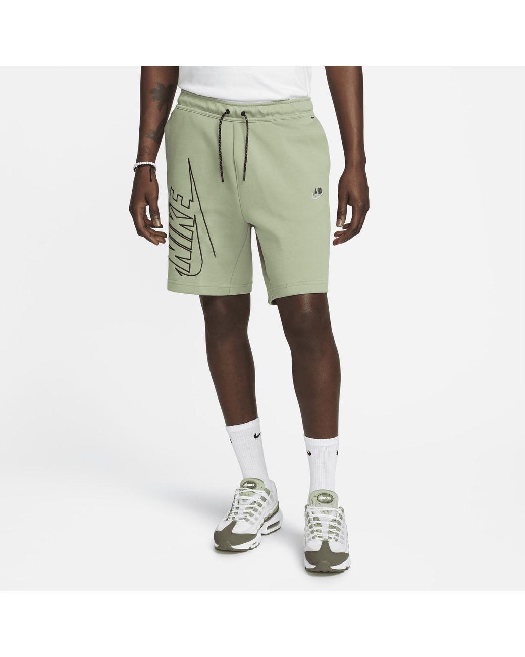 green nike tech fleece shorts