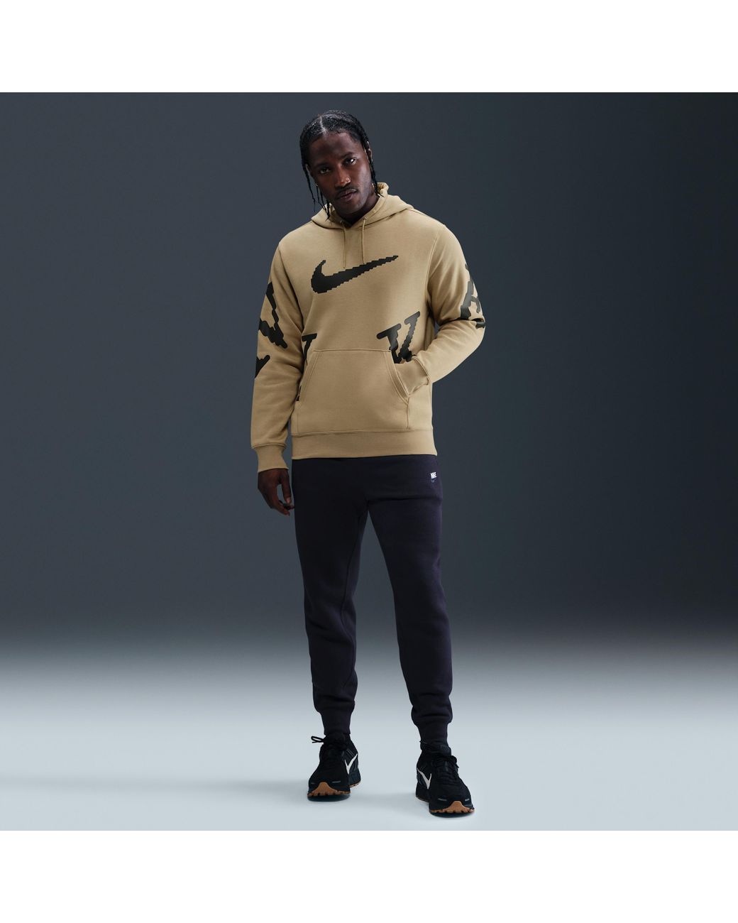 tan nike hoodie with black swoosh