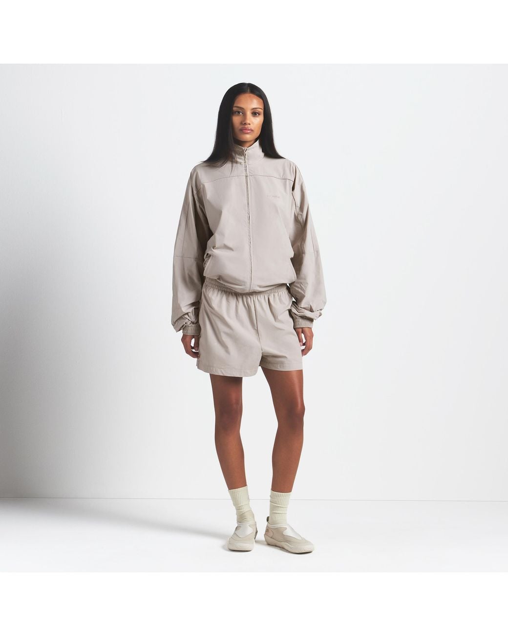 Nike Skims Woven Nylon Oversized Track Jacket in Natural | Lyst