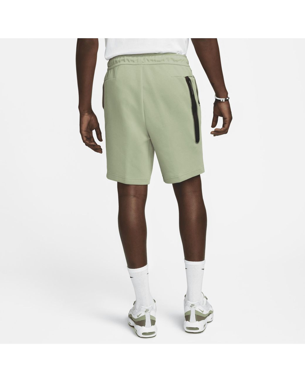 green nike tech fleece shorts