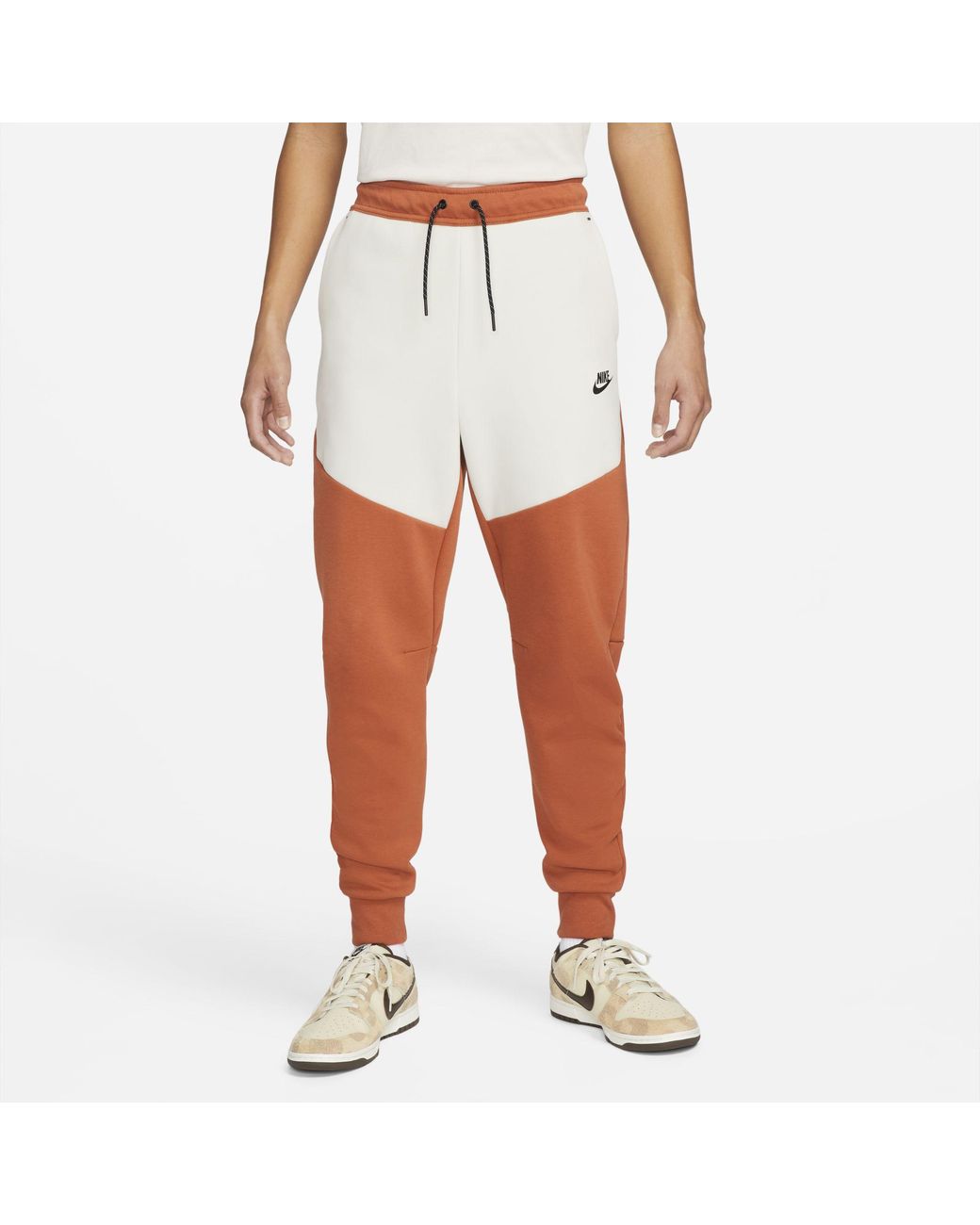 orange nike tech fleece pants