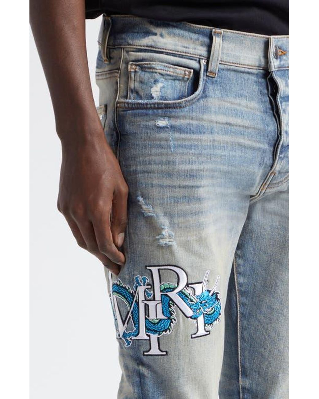 Amiri Mx1 Dragon Lunar New Year Ripped & Patched Jeans in Amiri Mx1 Dragon Lunar New Year Ripped & Patched Jeans in