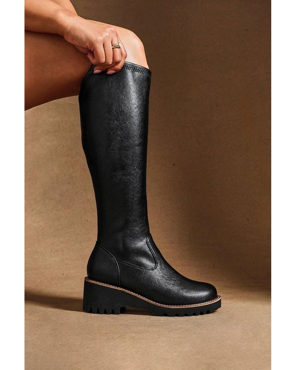 Linzi Black Maintain Wide Fit Faux Leather Stretch High Leg Wedge Boot