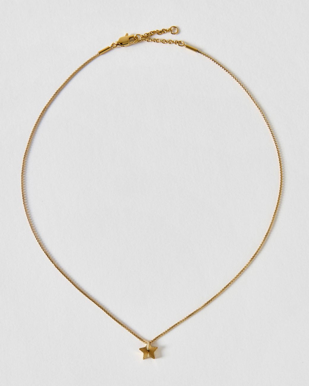 Oliver Bonas Metallic Finley Tone Waterproof Etched Star Reversible Pendant Necklace