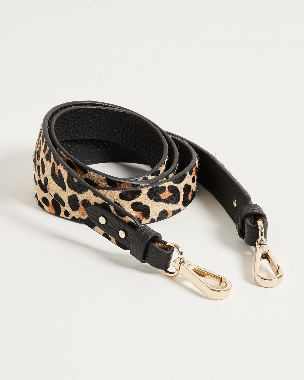 black bag with leopard print strap