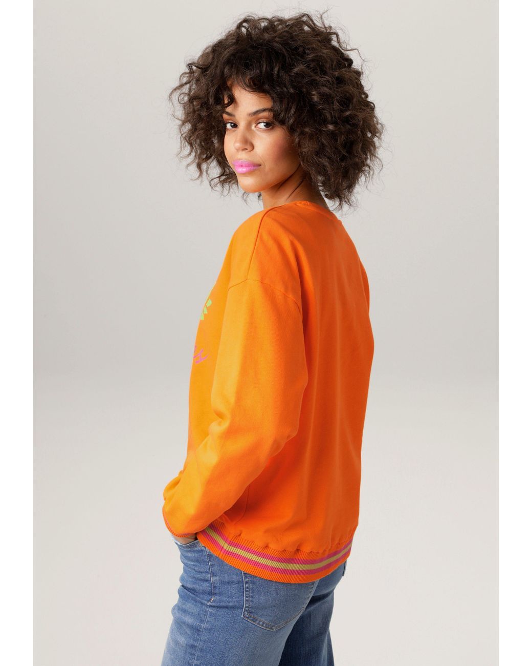 Aniston CASUAL Sweatshirt Frontdruck mit abstrakter Seerose und Schriftzug  in Orange | Lyst DE