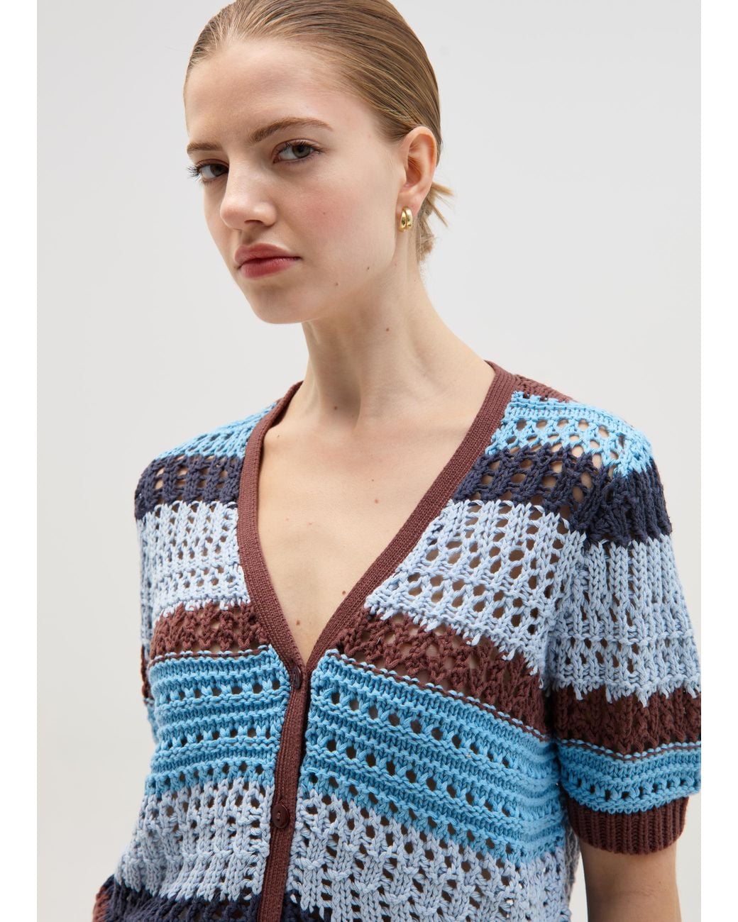 Cardigan da donna in maglia grossa aperto sul davanti