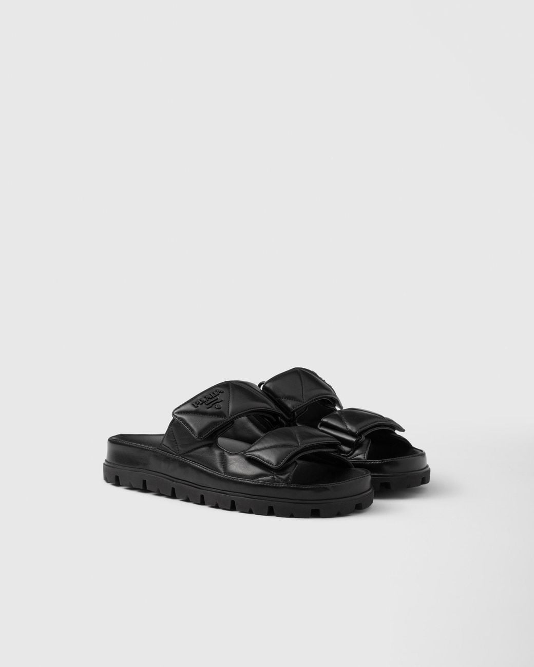 Prada Padded Nappa Leather Slides in Black | Lyst