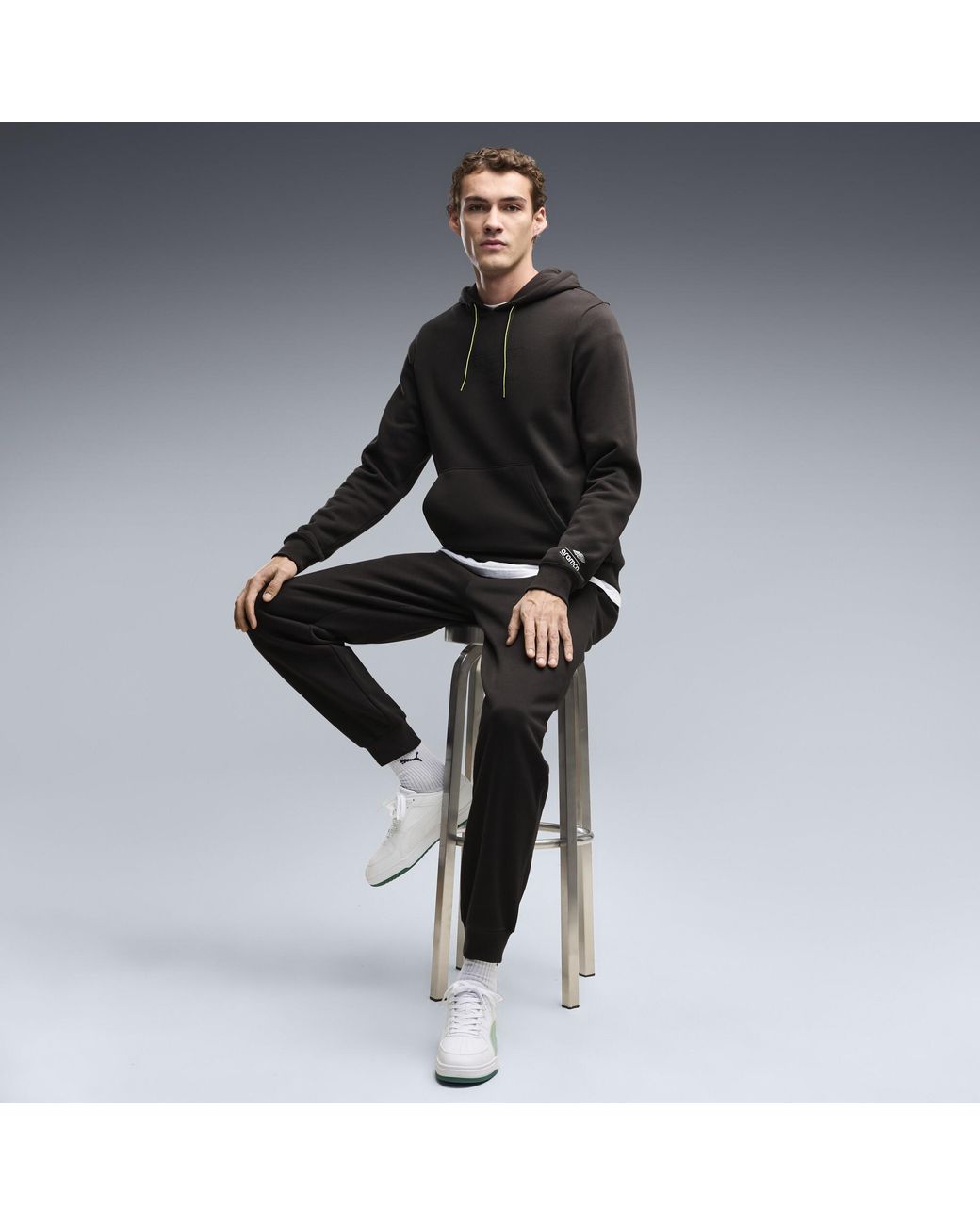 PUMA Black X Aston Martin Aramco F1 Team Essentials Hoodie for men