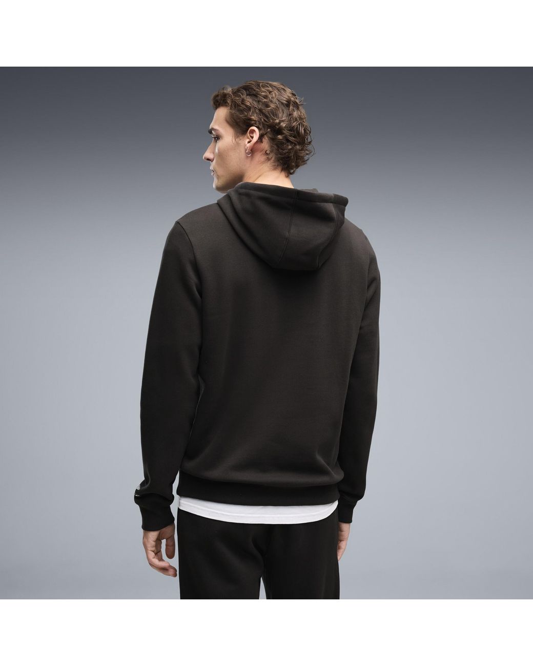 PUMA Black X Aston Martin Aramco F1 Team Essentials Hoodie for men